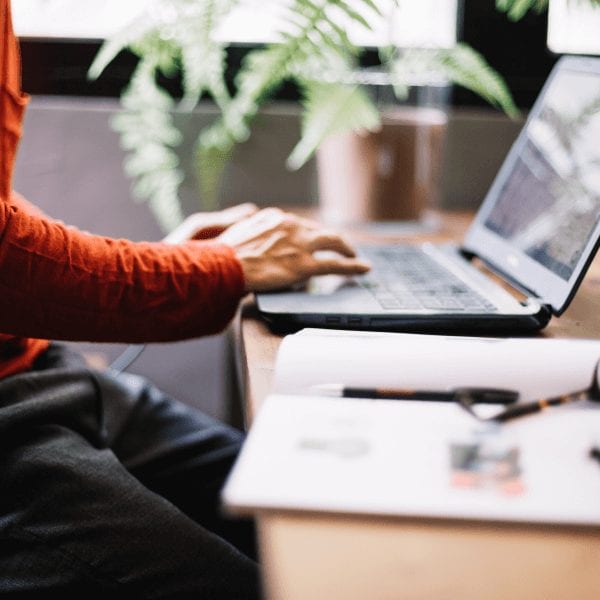 A male using a laptop computer