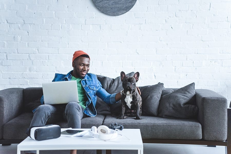 Man on a Laptop with His Dog
